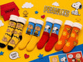 Calcetines Peanuts con diseños de Snoopy, Charlie Brown y Woodstock en colores amarillo, azul, rojo y naranja